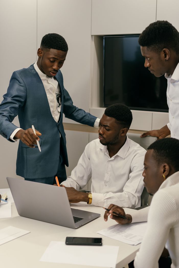 Entreprise A diverse team engaged in a productive meeting in a modern office environment.